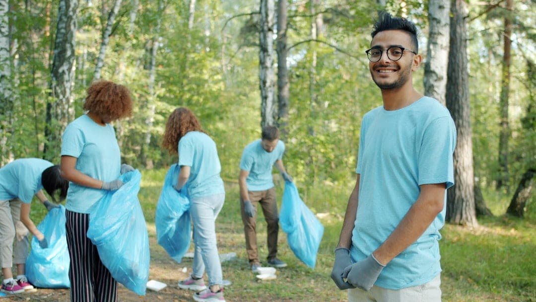 Volunteers extending hands to help in their community