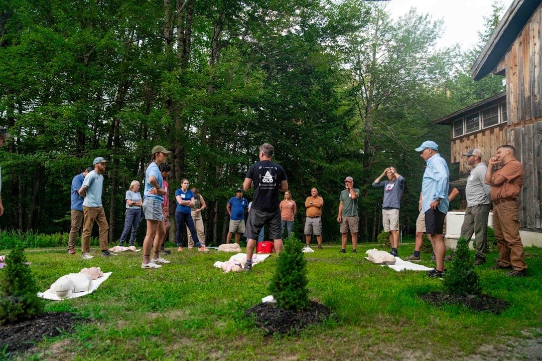 Community members working together in a garden, growing food and building connection